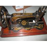 Early 20th century Singer sewing machine with fiddle base