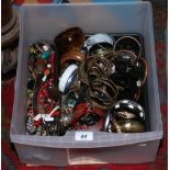 A large box of modern costume jewellery, mainly bangles.