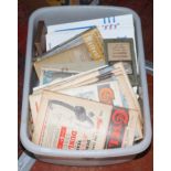 A box of mixed vintage ephemera including mid 20th century cycling magazines, cycling maps,