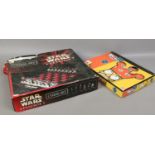 A Star Wars episode 1 chess set, along with The Simpsons chess set, both complete.