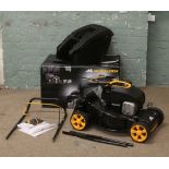 A McCulloch M40-125 petrol lawn mower in box.