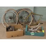 A quantity of vintage bicycle parts including a Carlton Flyer frame, four Brooks leather saddles,