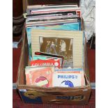 A box of L.P records and 7 inch singles mostly easy listening.