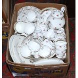 A box of mainly Colclough tea / dinnerwares decorated with roses.