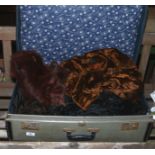 A suitcase and contents of Edwardian and later clothing including a ladies black velvet and feather