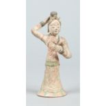 A Chinese Tang dynasty glazed earthenware figure modelled as a maiden holding a bi disc, 20cm.