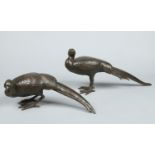 A pair of Japanese Meiji period patinated bronze sculptures modelled as a cock and hen pheasant in