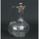 A Victorian glass carafe and associated white metal mounted cork stopper.