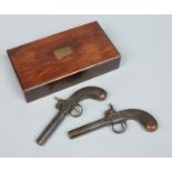 A pair of 19th century Belgian box lock pocket pistols in a case.