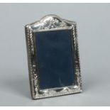 A silver eizel photograph frame by Carr's of Sheffield Ltd.