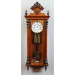 A 19th century walnut cased twin weight Vienna wall clock.