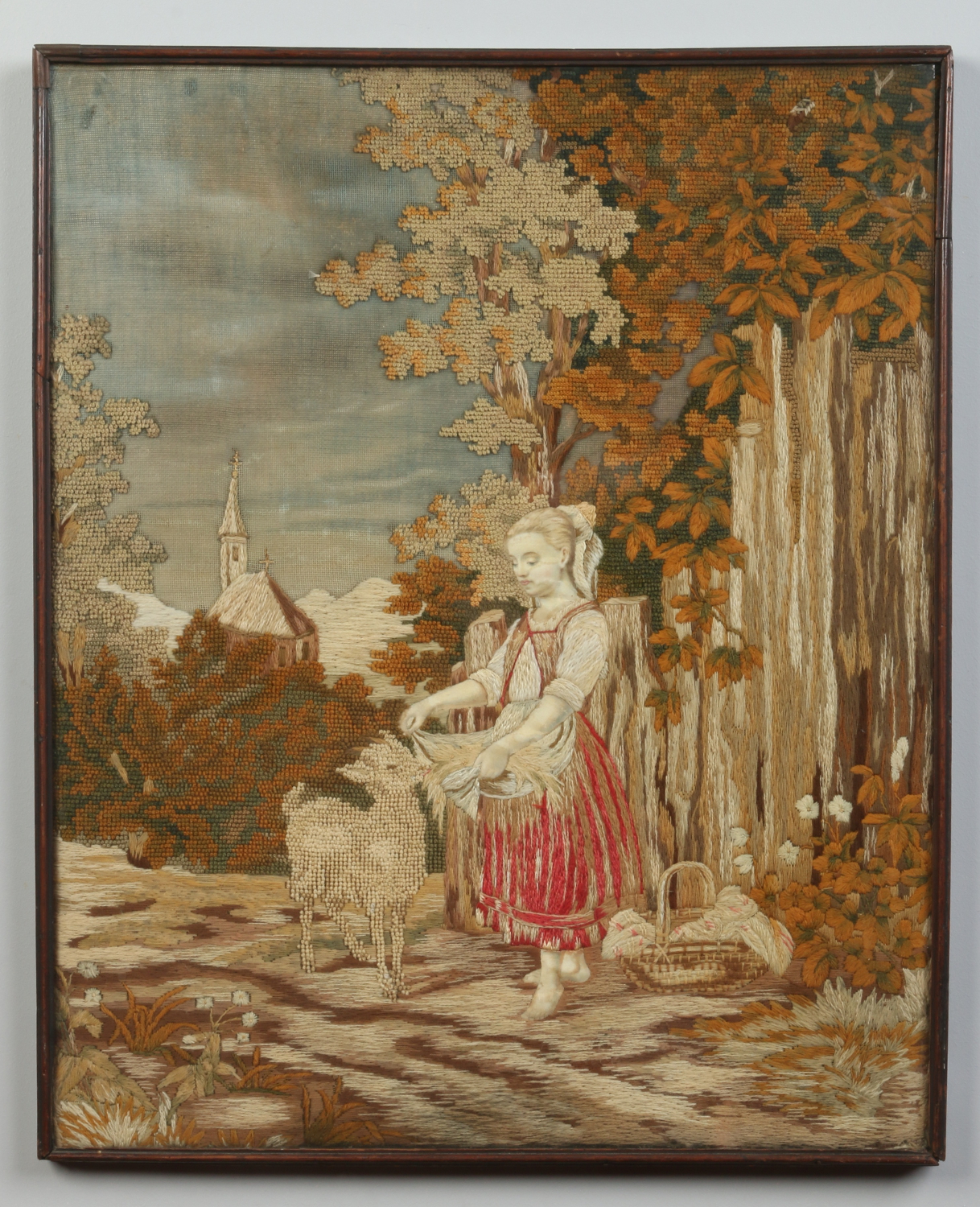 A 19th century silk and wool embroidered picture in a simple wooden mount.