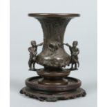 A Chinese patinated bronze trumpet shaped vase.