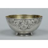 A Russian silver bowl. With gilt interior and having niello lambrequin border. Punch marks.