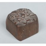 A 19th century Chinese carved bamboo scholars seal of square form and with rounded corners.