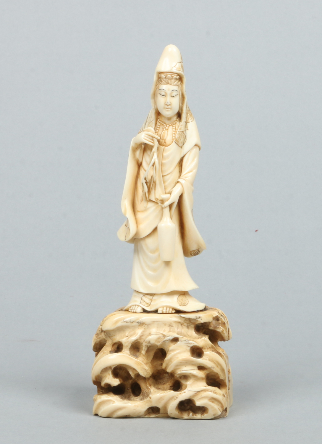 A Japanese Meiji period carved ivory okimono formed as Kuanyin.