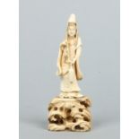 A Japanese Meiji period carved ivory okimono formed as Kuanyin.