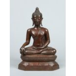 An Oriental patinated bronze figure of a seated Buddha, 38cm. Condition Report.