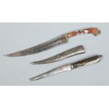 A 19th century Indian dagger with agate grip and niello inlaid metal scabbard along with another