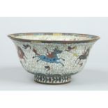 An antique Chinese cloisonne bowl with flared rim.