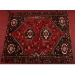 A Persian heavy pile hand woven wool village rug, 2m x 2m 40cm. Condition Report.