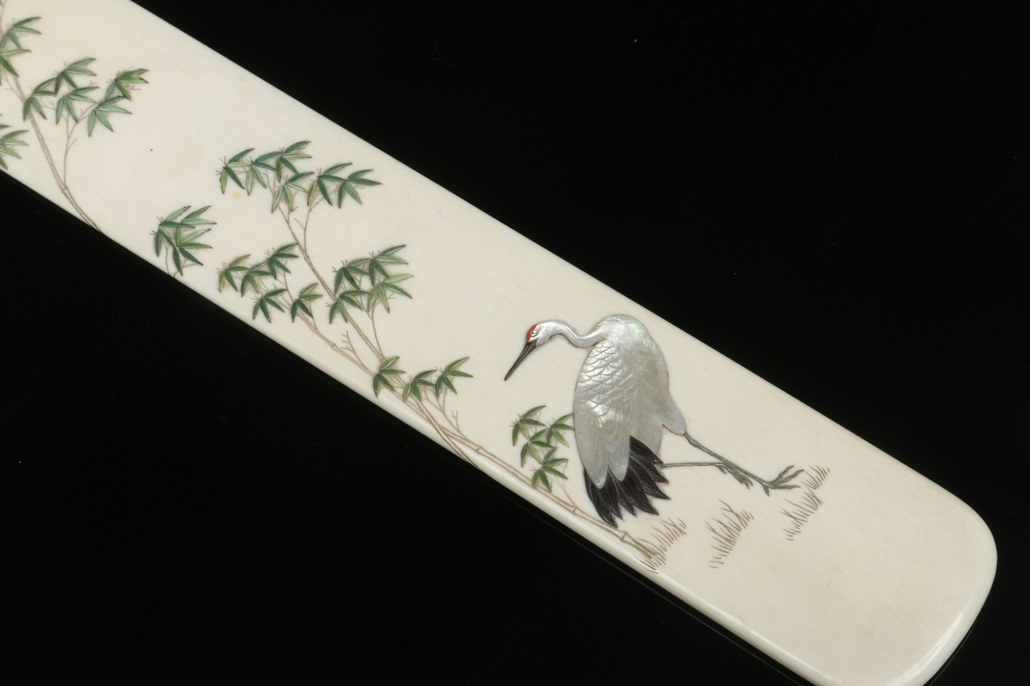 A Japanese Meiji period Shibayama ivory page turner. Decorated with a crane and bamboo soots. - Image 6 of 6