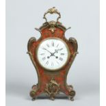 A French boulle work table clock with ormolu mounts.