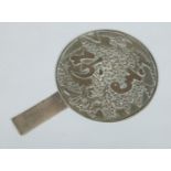 A Japanese Meiji period polished bronze hand mirror.