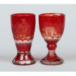 An early 20th century Bohemian ruby flash goblet and similar vase.