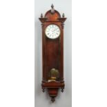 A 19th century rosewood single weight Vienna wall clock.
