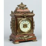 A Victorian mahogany and gilt brass mounted mantel clock.