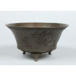 A Chinese 20th century bronze jardiniere of flared form and raised on three cabriole supports.