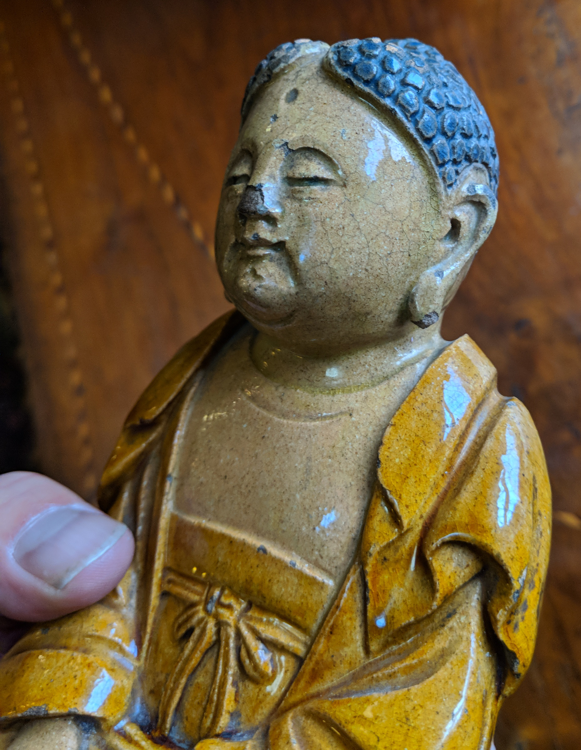 A Chinese earthenware figure of a seated meditating Buddha raised on a lotus plinth and in ochre - Image 4 of 7