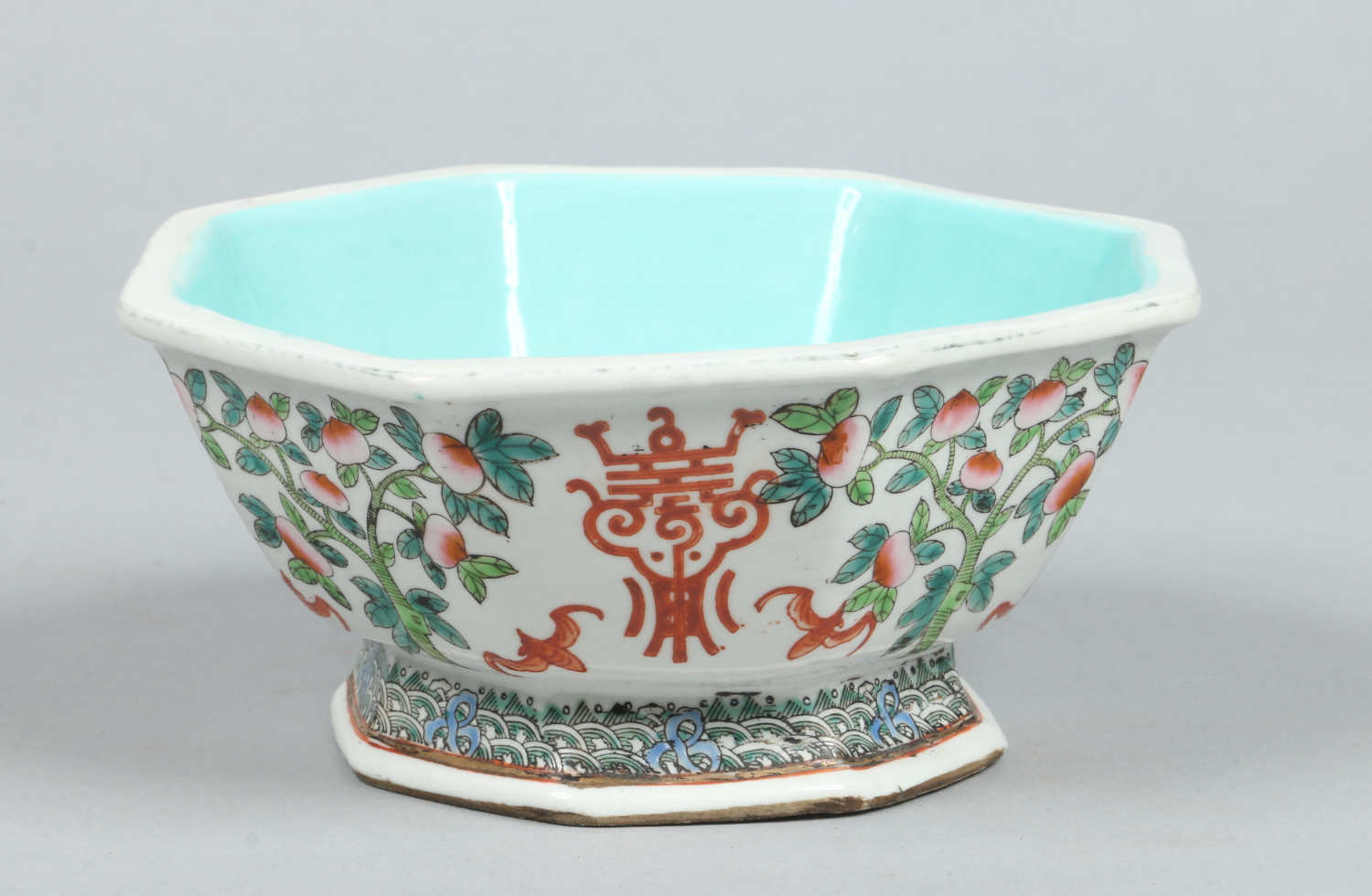 A Chinese octagonal bowl raised on a spreading foot.