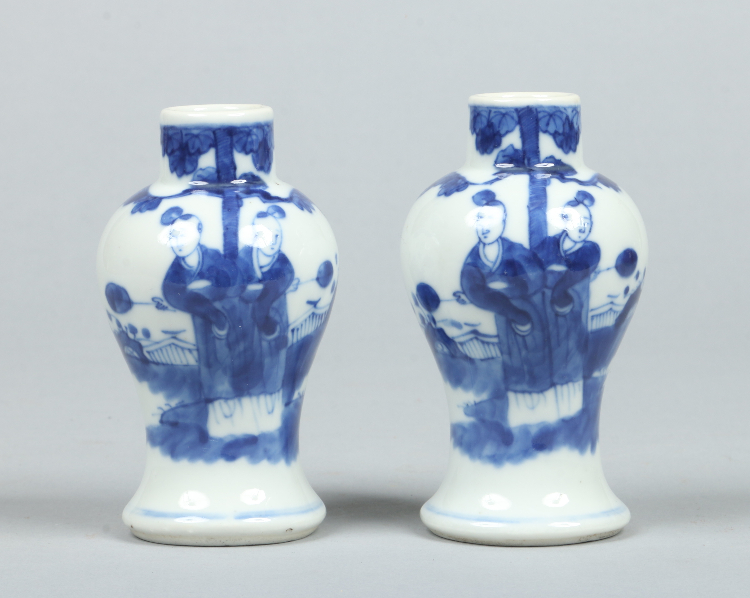 A pair of 19th century Chinese small blue and white baluster vases.