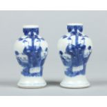 A pair of 19th century Chinese small blue and white baluster vases.