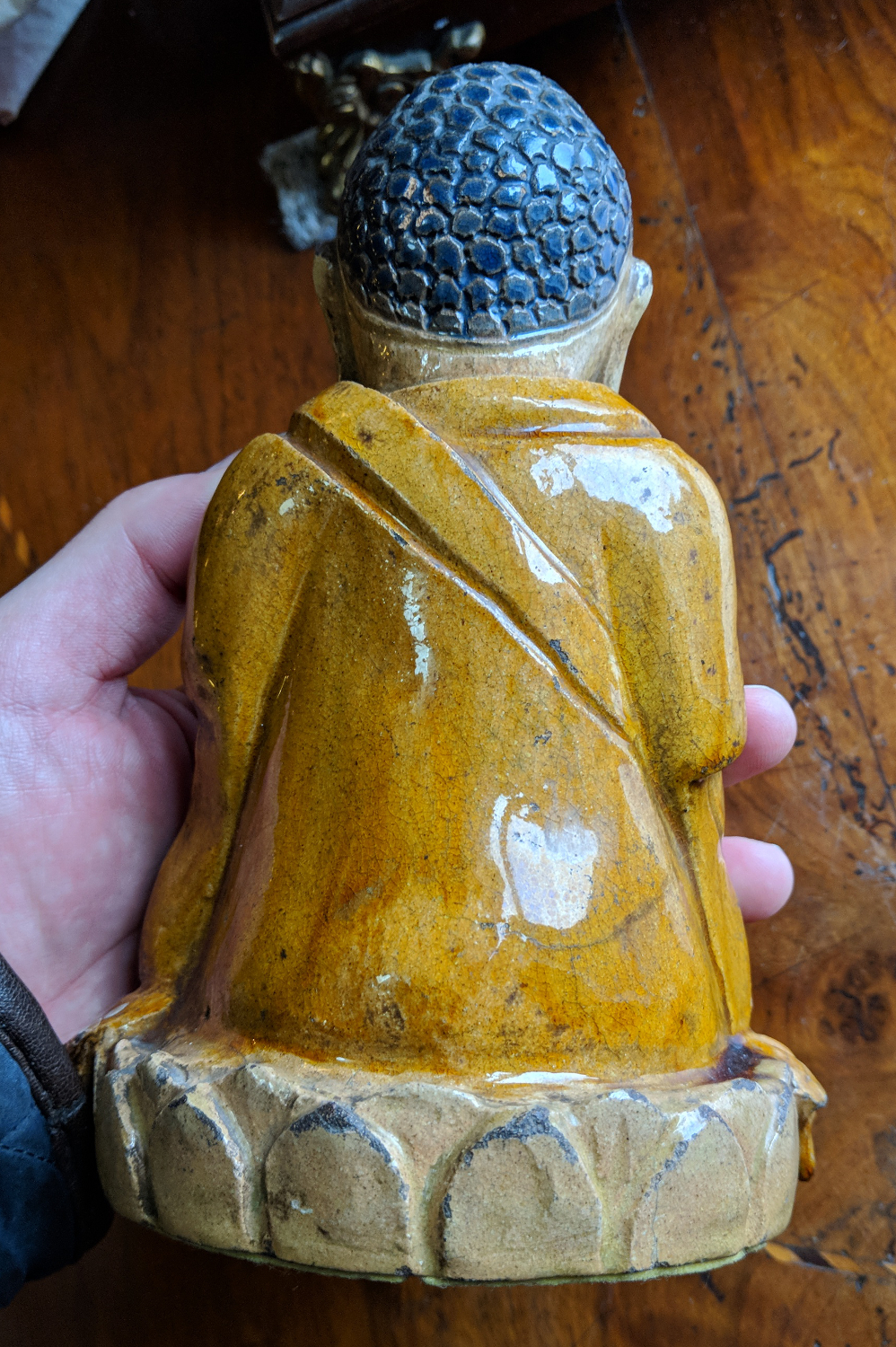 A Chinese earthenware figure of a seated meditating Buddha raised on a lotus plinth and in ochre - Image 2 of 7