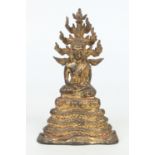 An antique gilt bronze and polychrome figure of a seated Buddha possibly Thai.