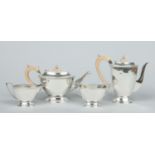 A silver four part tea and coffee service by John Turton & Co.