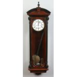 A 19th century walnut Vienna wall clock with ebonized moulding.