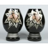 A pair of French Art Deco black opaque glass mantel vases.