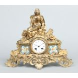 A 19th century French gilt bronze mantel clock surmounted with a figure of the Madonna and winged