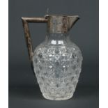 A Victorian cut glass claret jug with silver mount. Assayed London 1896, 21cm.