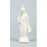 A Chinese blanc de chine figure of a fisherman.