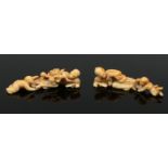 A pair of early 19th century Japanese carved ivory okimono or scroll weights.