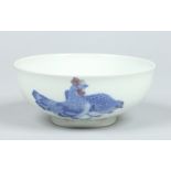 An early 20th century Chinese bowl decorated in underglaze blue and red with a cockerel,