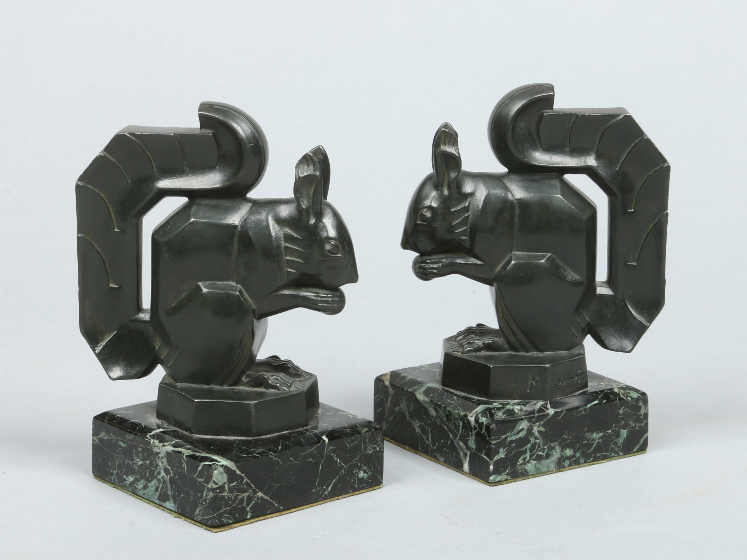 Max Le Verrier (French 1891-1973) a pair of Art Deco verdigris bronze figures.