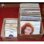 A box of L.P records along with a box of singles to include rock, pop and easy listening.