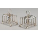 A pair of Edwardian silver five bar toast racks, assayed Sheffield 1908 by George Edward & Sons,