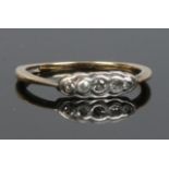 A 9ct gold and platinum five stone diamond ring. Size M.